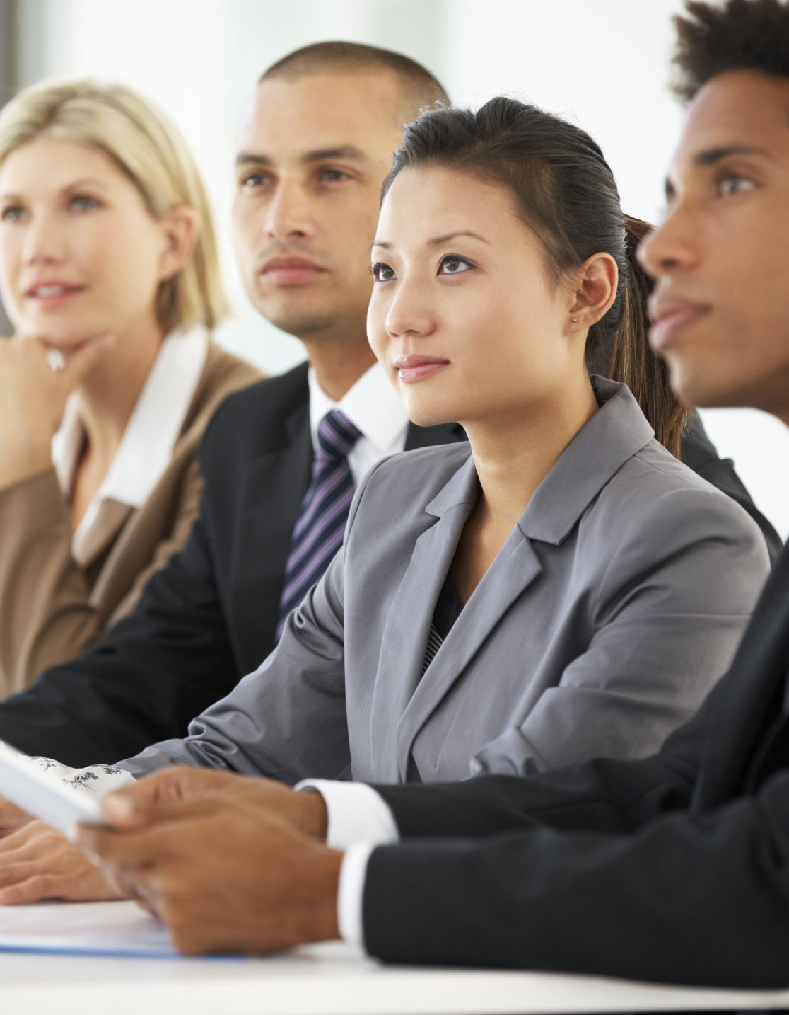 Professionals at a conference table in a meeting